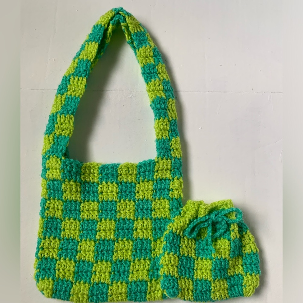 Handmade crochet mini purse with a matching pouch.